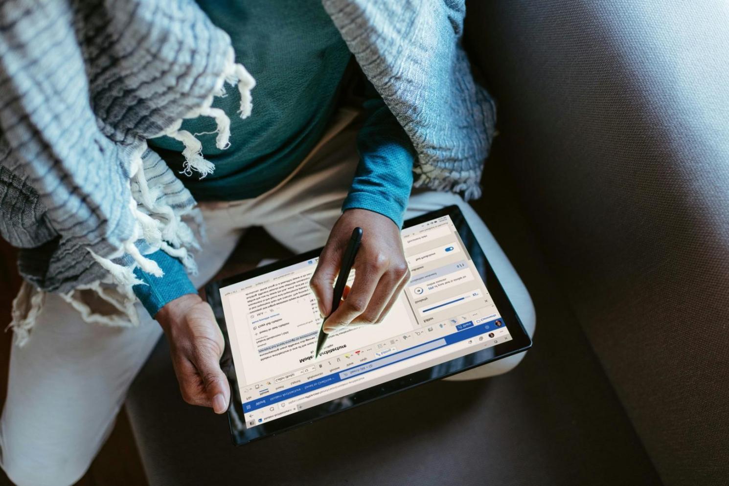 Yoga instructor providing hands-on adjustment to student in downward dog pose during personalized session